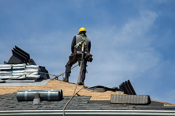 Professional Roofing technician working in Slickville, PA